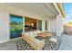 Covered patio with outdoor seating, pavers, and a view of the backyard at 21391 W Mariposa St, Buckeye, AZ 85396