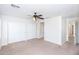Bright bedroom with carpeted floors, a ceiling fan, and large closet at 2174 W Kristina Ave, San Tan Valley, AZ 85144