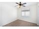 Cozy bedroom with neutral carpet, a ceiling fan, and a window with blinds at 2174 W Kristina Ave, San Tan Valley, AZ 85144