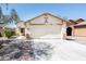 Charming single-story home with a two-car garage and low maintenance landscaping at 2174 W Kristina Ave, San Tan Valley, AZ 85144