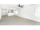 Bright and airy living room with neutral carpet, ceiling fan, and generous natural light at 2174 W Kristina Ave, San Tan Valley, AZ 85144
