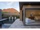 Backyard view showcasing a tranquil pool, modern architecture, and a seamless transition to the main bedroom at 24863 N 103Rd Way, Scottsdale, AZ 85255