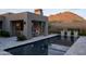 Stunning backyard with an outdoor fireplace, modern pool, and picturesque mountain views at 24863 N 103Rd Way, Scottsdale, AZ 85255