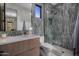 Stylish bathroom featuring modern fixtures, a unique shower, and elegant tiling at 24863 N 103Rd Way, Scottsdale, AZ 85255