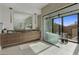 Luxurious bathroom with a freestanding tub, glass enclosed shower, double vanity, and stylish finishes at 24863 N 103Rd Way, Scottsdale, AZ 85255