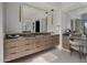Elegant bathroom featuring double vanity, granite countertops, modern lighting, and a makeup area at 24863 N 103Rd Way, Scottsdale, AZ 85255