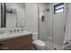 Bathroom with a modern vanity, stylish fixtures, and a glass-enclosed shower with tiled walls at 24863 N 103Rd Way, Scottsdale, AZ 85255
