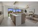 Open-concept kitchen and living room filled with natural light, showcasing modern design and seamless flow at 24863 N 103Rd Way, Scottsdale, AZ 85255