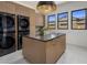 Laundry room with modern appliances, ample counter space, and natural light at 24863 N 103Rd Way, Scottsdale, AZ 85255