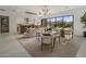 Open-concept living area with modern furnishings, dining space, and mountain views at 24863 N 103Rd Way, Scottsdale, AZ 85255