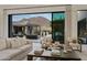 Bright living room featuring neutral decor, modern furnishings, and a seamless indoor-outdoor flow at 24863 N 103Rd Way, Scottsdale, AZ 85255