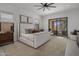 Comfortable main bedroom with a sliding glass door to a private outdoor space, stylish decor, and ample lighting at 24863 N 103Rd Way, Scottsdale, AZ 85255