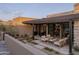 Relaxing outdoor patio featuring comfortable seating, lush landscaping, and seamless indoor-outdoor living spaces at 24863 N 103Rd Way, Scottsdale, AZ 85255
