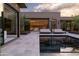 Stunning pool area with modern loungers, lush landscaping, and seamless flow to indoor living spaces at 24863 N 103Rd Way, Scottsdale, AZ 85255