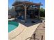 Relaxing poolside cabana next to a pool, complete with seating area and bar at 2501 E Pebble Beach Dr, Tempe, AZ 85282
