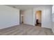 Spacious carpeted bedroom with walk-in closet leading to bathroom at 25602 W Coles Rd, Buckeye, AZ 85326