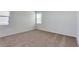 Clean, bright carpeted bedroom with blinds and light-colored walls at 25602 W Coles Rd, Buckeye, AZ 85326