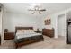 Stylish bedroom boasts modern ceiling fan, king-size bed, and furniture with drawers at 25915 W Tina Ln, Buckeye, AZ 85396