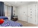 Comfortable bedroom with a window, closet, and carpet flooring, decorated with kid-friendly art at 25915 W Tina Ln, Buckeye, AZ 85396