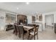 Open-concept dining room with a large wooden table and direct access to the updated kitchen at 25915 W Tina Ln, Buckeye, AZ 85396