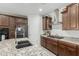 Beautiful kitchen with stainless appliances, granite countertops, and modern fixtures at 25915 W Tina Ln, Buckeye, AZ 85396