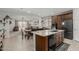 Open-concept kitchen and living area with granite countertops, modern appliances, and ample counter space at 25915 W Tina Ln, Buckeye, AZ 85396