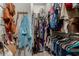 Organized walk-in closet featuring ample hanging space, shelving, and storage for clothes and accessories at 25915 W Tina Ln, Buckeye, AZ 85396