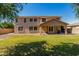 Spacious backyard featuring a well-maintained lawn and a covered patio, perfect for outdoor living and entertaining at 3065 E Harvard Ave, Gilbert, AZ 85234
