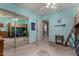 Bright bedroom with bunk beds, a ceiling fan, and large mirrored closet doors at 3065 E Harvard Ave, Gilbert, AZ 85234
