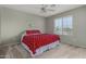 Cozy bedroom featuring a ceiling fan and a window to let in natural light at 3065 E Harvard Ave, Gilbert, AZ 85234