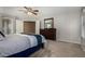 Bedroom showcasing neutral walls and carpet, complemented by a dark wood dresser at 3065 E Harvard Ave, Gilbert, AZ 85234
