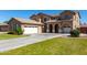 Attractive stucco home boasting multiple garages and a spacious driveway at 3065 E Harvard Ave, Gilbert, AZ 85234