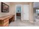 Hallway featuring a desk and doorway leading to a bedroom with a dresser at 3065 E Harvard Ave, Gilbert, AZ 85234