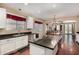 Gourmet kitchen features stainless steel appliances, granite countertops, and white cabinetry at 3065 E Harvard Ave, Gilbert, AZ 85234