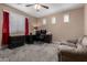 Office with a large window, dark desk, and a comfortable couch at 3065 E Harvard Ave, Gilbert, AZ 85234