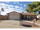 Charming single-story home with brick accents, a two-car garage, and a well-maintained front yard at 3121 W Laurie Ln, Phoenix, AZ 85051