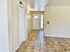 Inviting foyer with neutral walls, tiled flooring, closet storage, and views of the front door at 3121 W Laurie Ln, Phoenix, AZ 85051