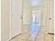 Bright living area featuring tiled floors with an open doorway and lots of natural light at 3121 W Laurie Ln, Phoenix, AZ 85051