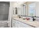 Bathroom features double vanity, modern finishes, and a shower-tub combo with gray tile at 31320 N 54Th Pl, Cave Creek, AZ 85331