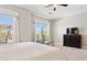 Bright primary bedroom with large windows providing natural light and backyard views at 31320 N 54Th Pl, Cave Creek, AZ 85331