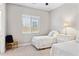 Bright bedroom featuring twin beds, neutral walls, and a window with blinds at 31320 N 54Th Pl, Cave Creek, AZ 85331