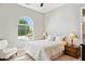 Sunlit bedroom with a vaulted window, plush carpet, and a comfortable queen-size bed at 31320 N 54Th Pl, Cave Creek, AZ 85331