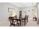 Traditional dining room with a large wooden table, elegant chairs, and decorative accents at 31320 N 54Th Pl, Cave Creek, AZ 85331