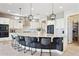 Modern kitchen featuring pendant lights, an island with seating, and stainless steel appliances at 31320 N 54Th Pl, Cave Creek, AZ 85331