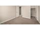 Bedroom with neutral walls, plush carpet, and a view into the hallway at 3449 E Sheffield Rd, Gilbert, AZ 85296
