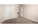 Neutral bedroom featuring carpet, large closet, and an open doorway to the en suite bathroom at 3449 E Sheffield Rd, Gilbert, AZ 85296