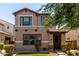 Charming two-story home features a covered entrance and well-maintained landscaping at 3449 E Sheffield Rd, Gilbert, AZ 85296