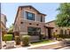 View of the home's well-maintained landscaping and inviting entrance at 3449 E Sheffield Rd, Gilbert, AZ 85296