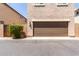 Attached two-car garage with brown door at 3449 E Sheffield Rd, Gilbert, AZ 85296