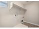 Laundry room featuring utility shelf and tile flooring at 3449 E Sheffield Rd, Gilbert, AZ 85296